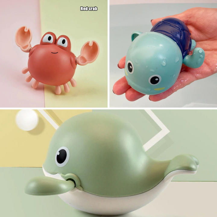 Three-piece bath toy set showing a coral crab, blue turtle, and green whale