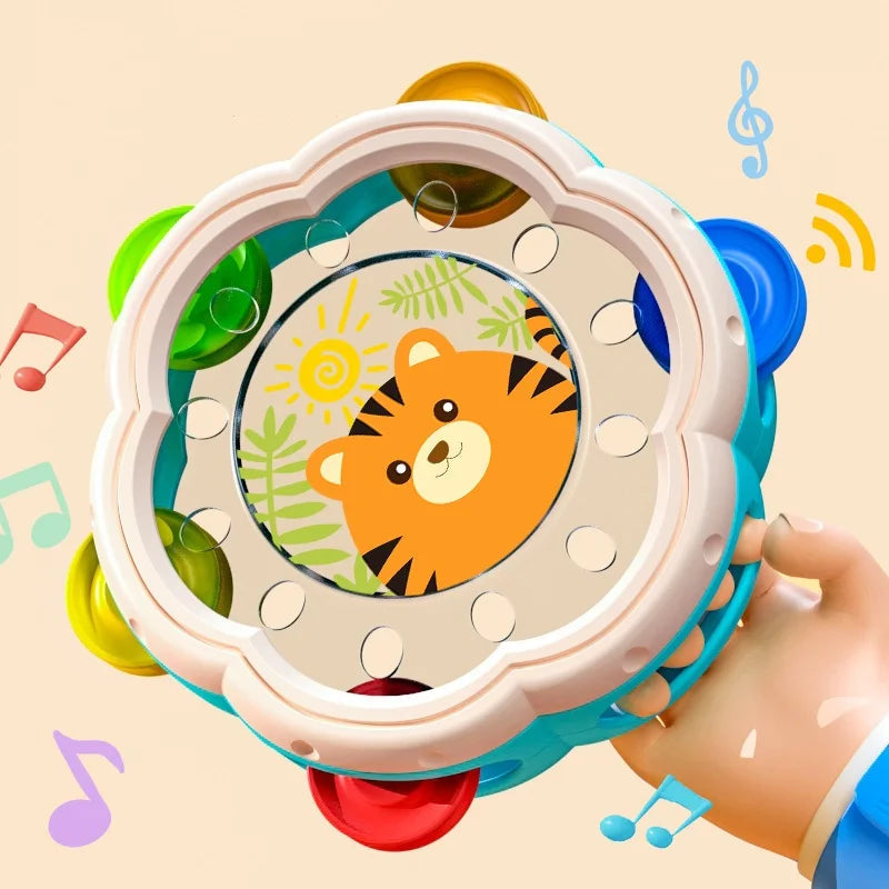 Tiger tambourine held by its turquoise handle, with colorful jingles around the rim