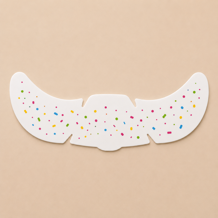 Temporary face sticker sheet with small scattered confetti-like marks