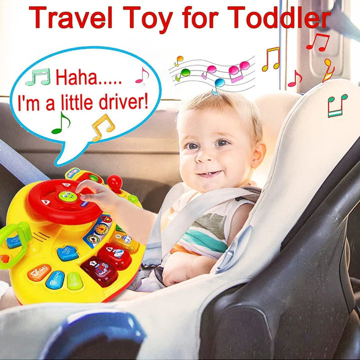 Toddler playing with the yellow steering wheel toy in a car seat