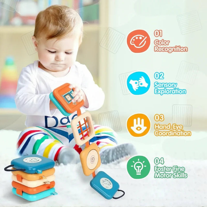 Toddler exploring the colorful activity board while seated on the floor