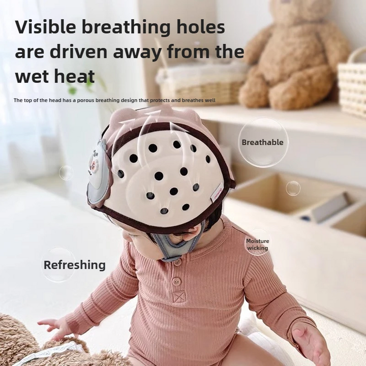 Child wearing a headguard with round ventilation openings across the crown