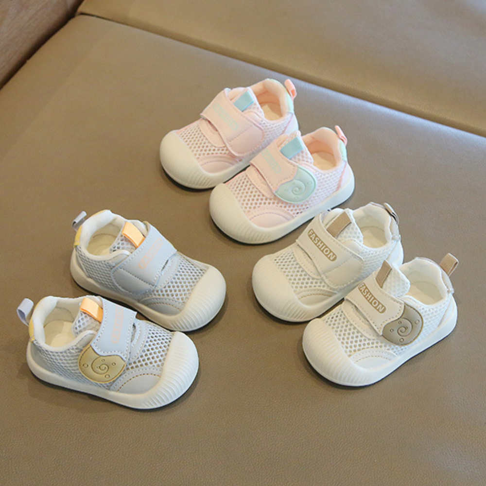 Three pairs of toddler sneakers with wide straps and bear details in pink, white and blue
