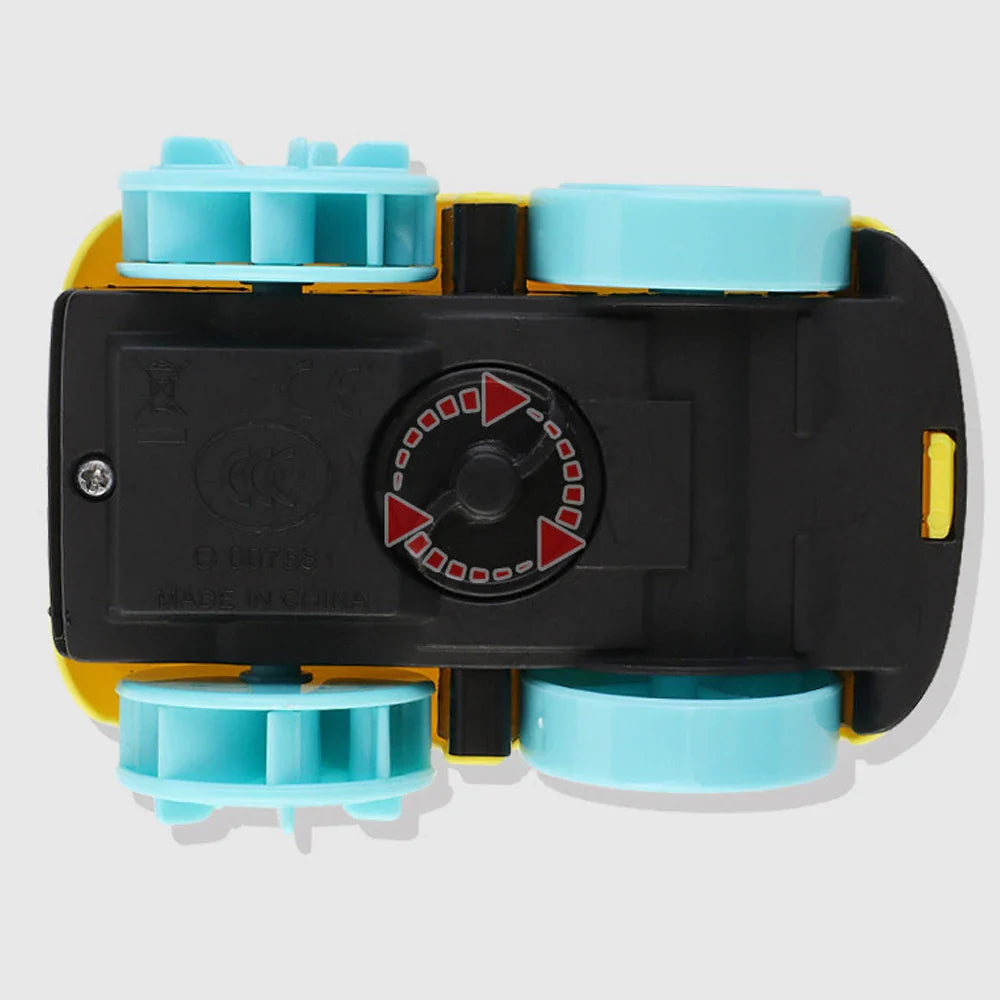 Underside of the yellow toy car showing its winding knob and blue wheels.