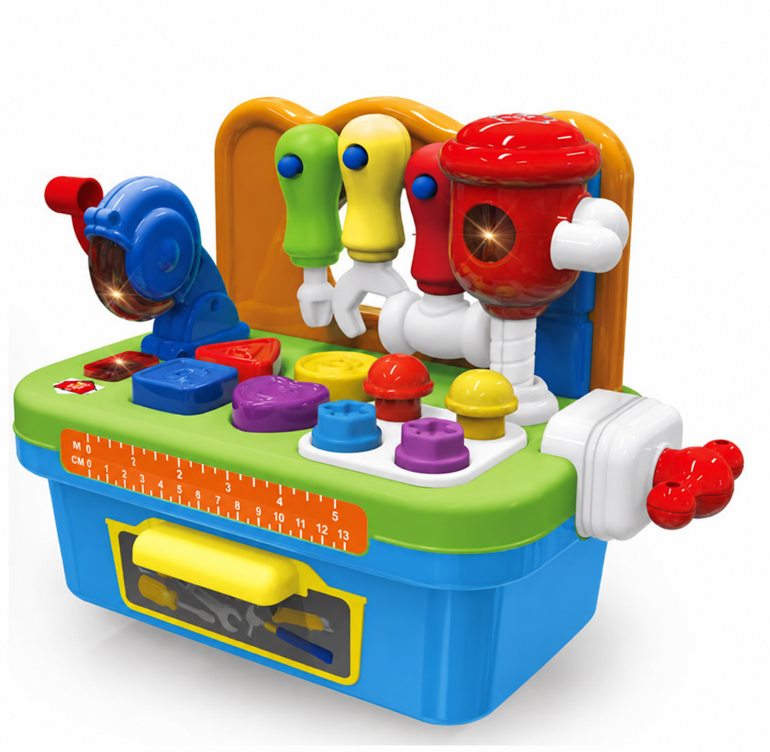 Angled view of a toy workbench with a red pretend drill, blue saw, and colorful worktop pieces