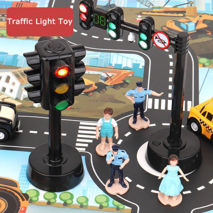 Upright and overhead traffic-light toys on a road play mat with miniature figures.