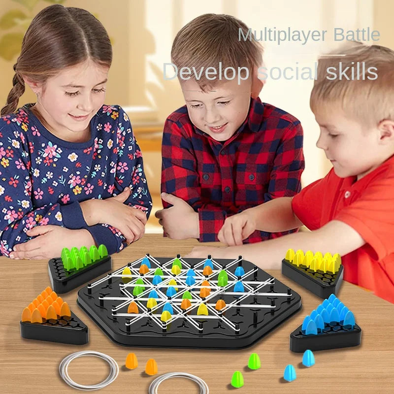 Three children gathered around a triangle strategy game with colorful pieces and rubber bands