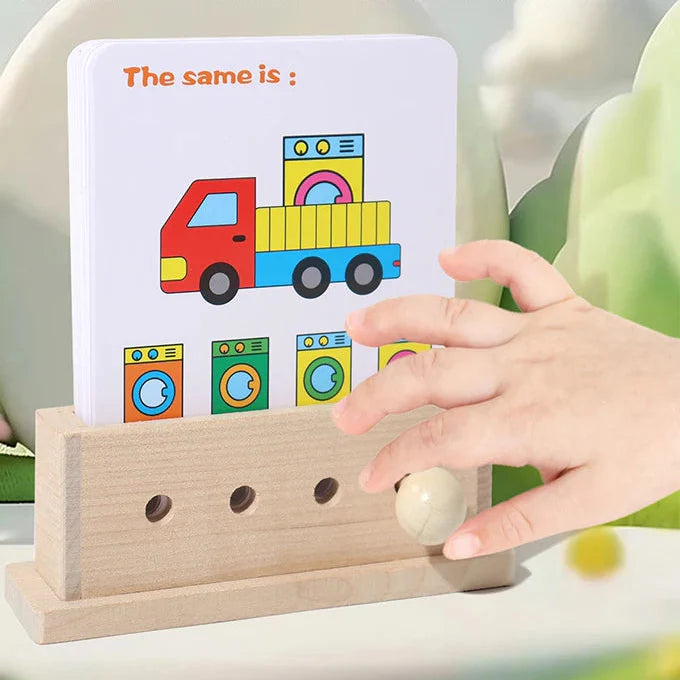 Child choosing an answer on a truck-and-appliance matching card in a wooden puzzle base