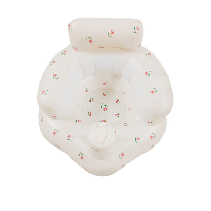 White inflatable baby seat with tulip prints, a raised backrest, and rounded armrests.
