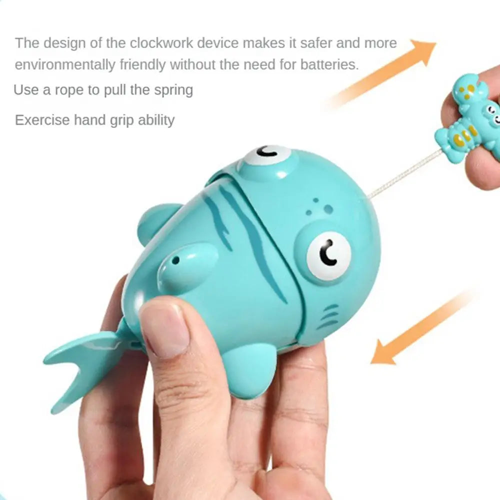 Hands pulling the cord on a turquoise animal bath toy