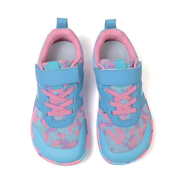 Top view of turquoise and pink sneakers showing mesh uppers, pink laces, and straps