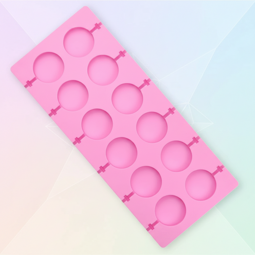 Pink silicone lollipop mold with twelve round cavities on a pastel background