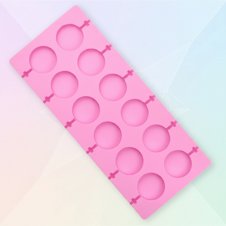 Pink silicone lollipop mold with twelve round cavities on a pastel background