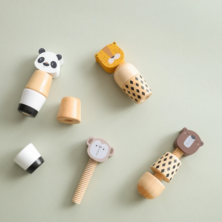 Partly disassembled wooden animal toys showing removable body sections and a threaded post
