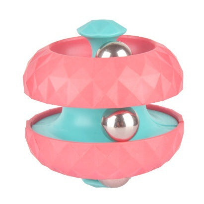 Pink fidget ball with a turquoise center and silver-colored balls in the tracks.