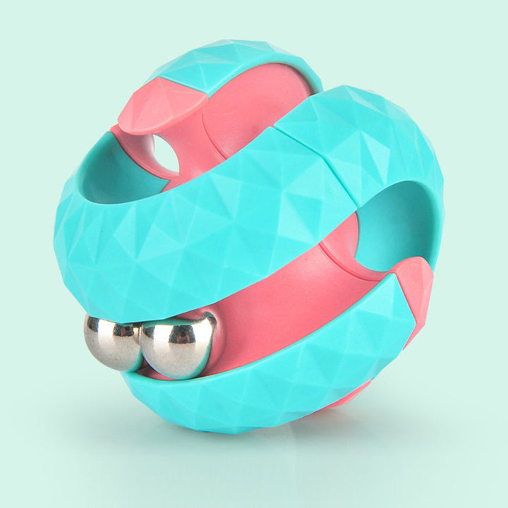 Close-up of a turquoise and pink fidget ball with textured bands and shiny balls.
