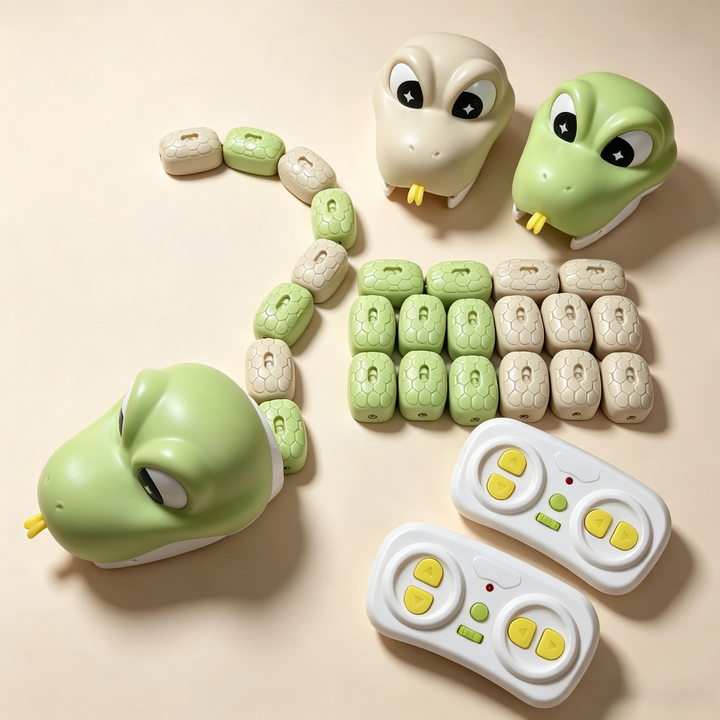 Green and beige snake toy heads displayed with loose body segments and two wireless remotes