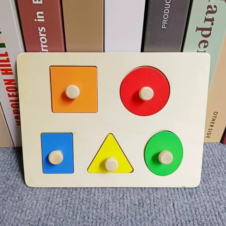 Rectangular wooden peg puzzle with five colorful shape pieces arranged in two rows
