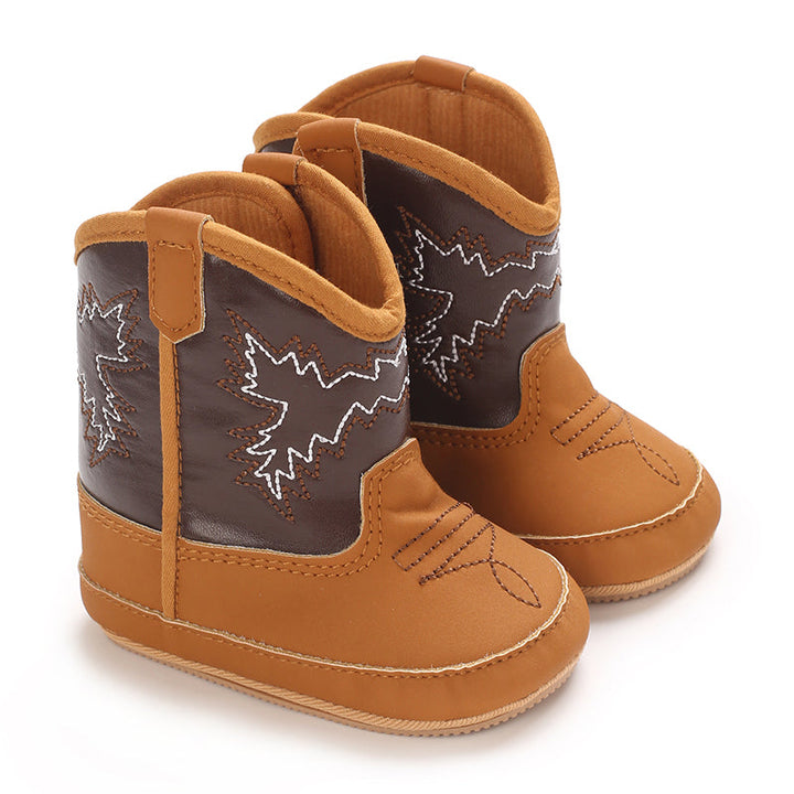 Two-tone tan and dark brown baby cowboy boots with decorative western stitching