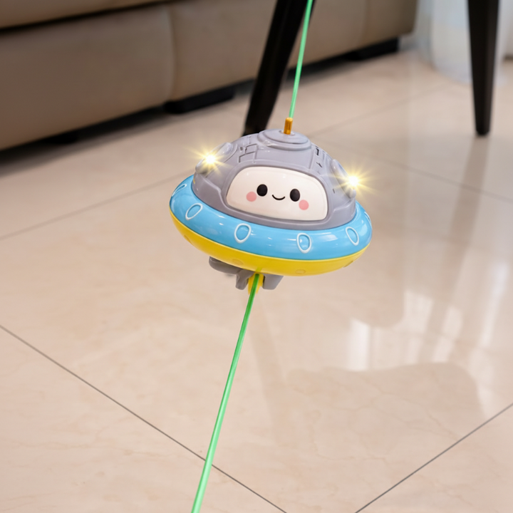 Blue and yellow UFO balance toy balancing on a taut green cord.