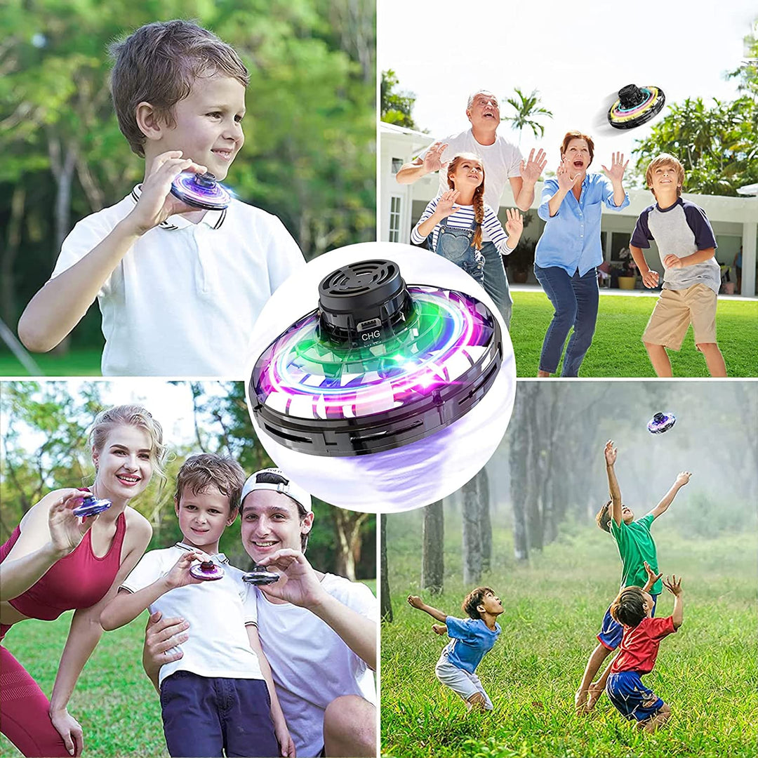 Children and adults playing with a light-up UFO drone outdoors