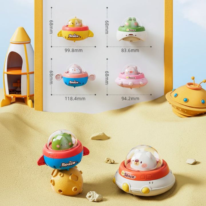 Measurement chart showing four UFO toy designs with widths from 83.6 to 118.4 mm.