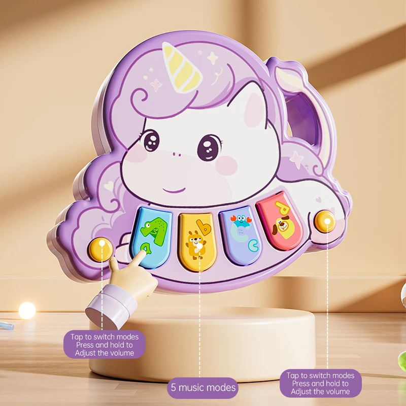 Finger pressing a button on a purple unicorn piano with four colorful keys