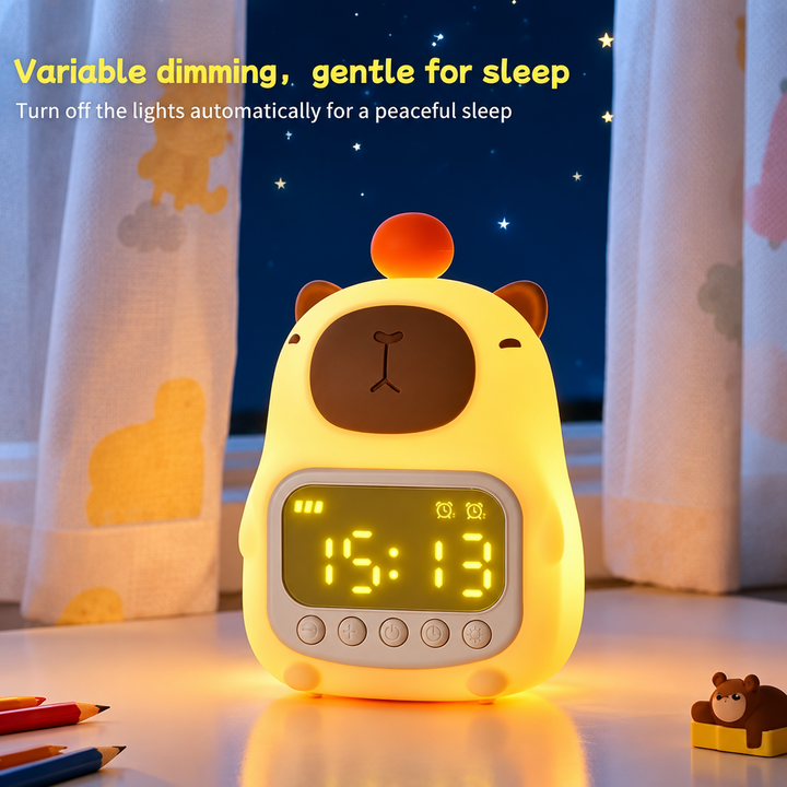 Illuminated capybara night light clock on a desk in front of curtains.