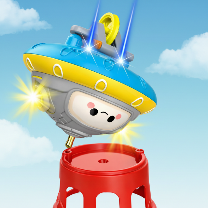 UFO balance toy shown upside down above a red stand.