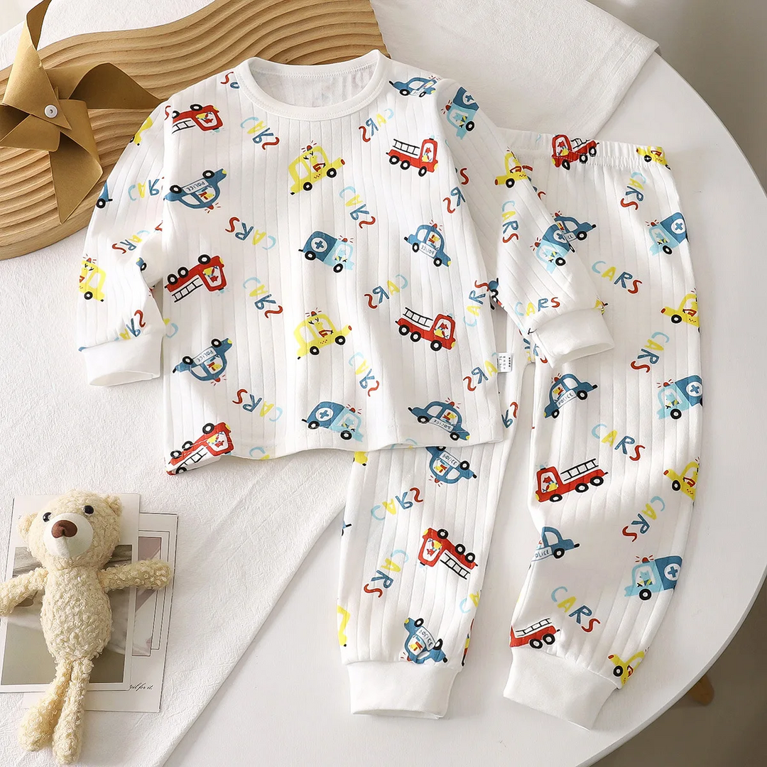 White two-piece vehicle-print pajama set with long sleeves and matching pants