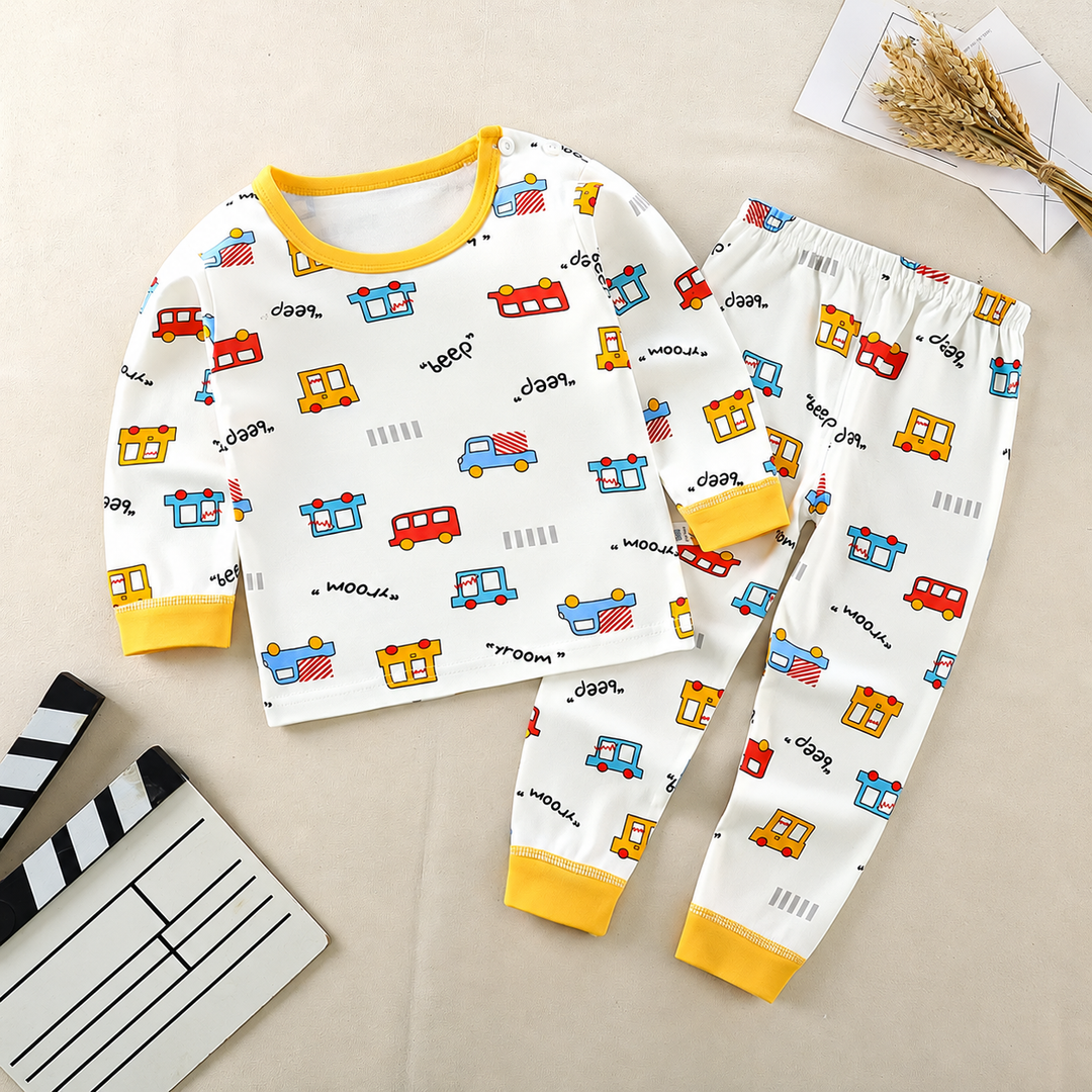 White vehicle-print pajama set with yellow trim and matching long pants