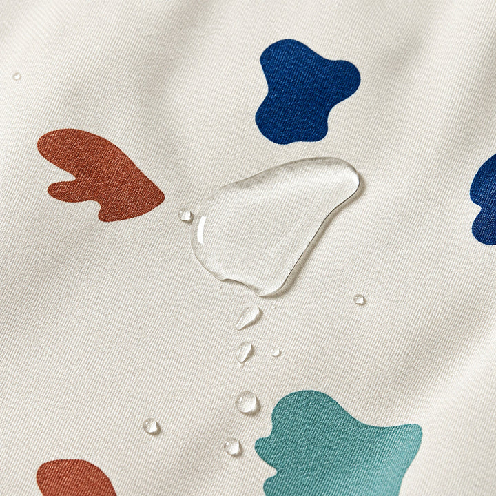 Water droplets beading on the cream printed outer fabric.