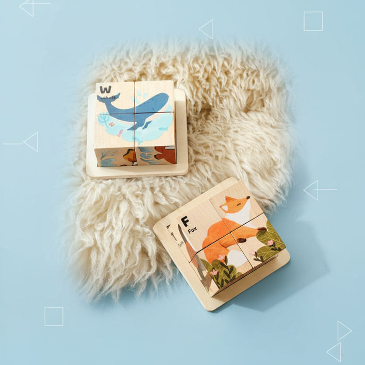 Whale and fox wooden block puzzles in trays on a blue background