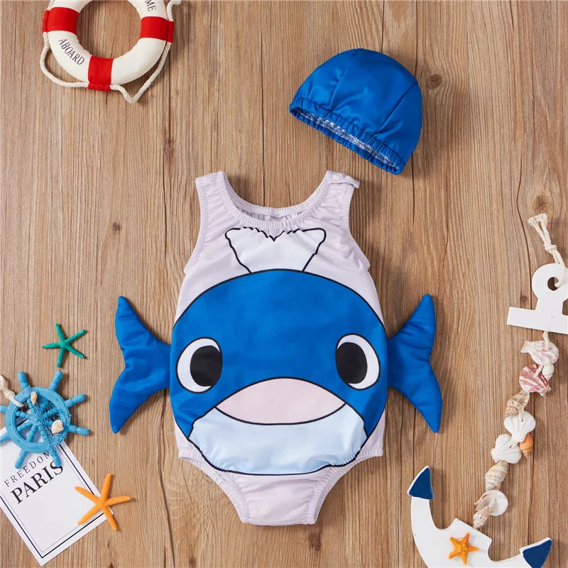 Whale swimsuit with blue side fins and a coordinating blue swim cap