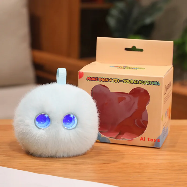 White round AI plush toy with blue eyes and a top loop beside its box