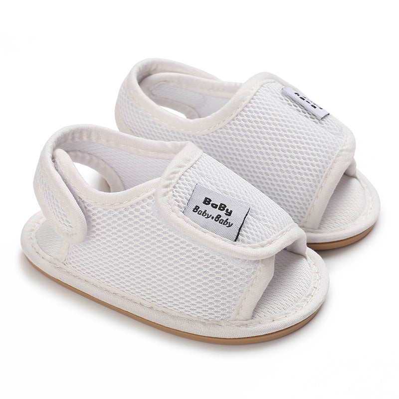 White mesh baby sandals with open toes, adjustable straps and heel loops
