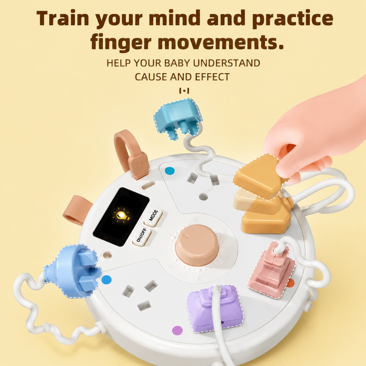Hand connecting a yellow toy plug to the White busy board