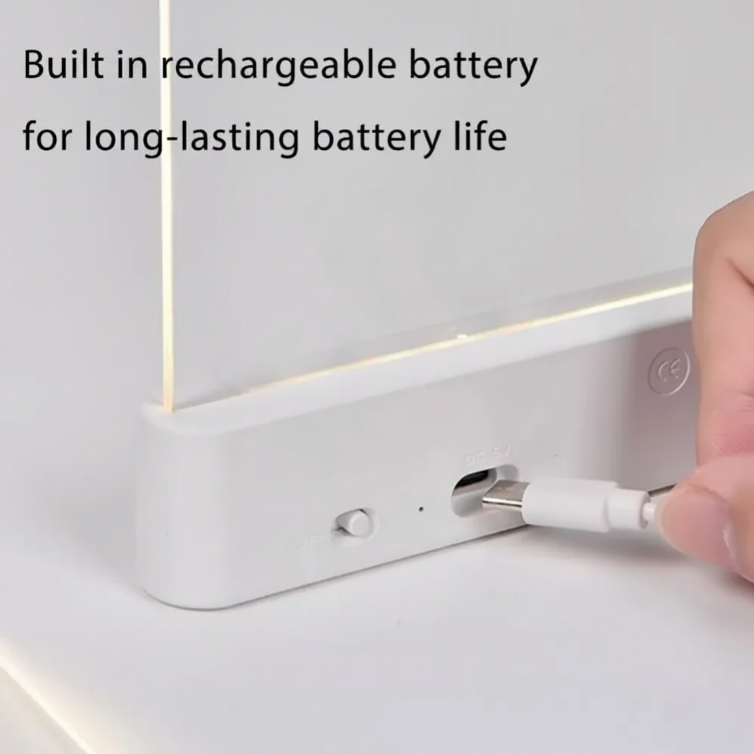 USB charging cable being connected to the back of a white LED book light