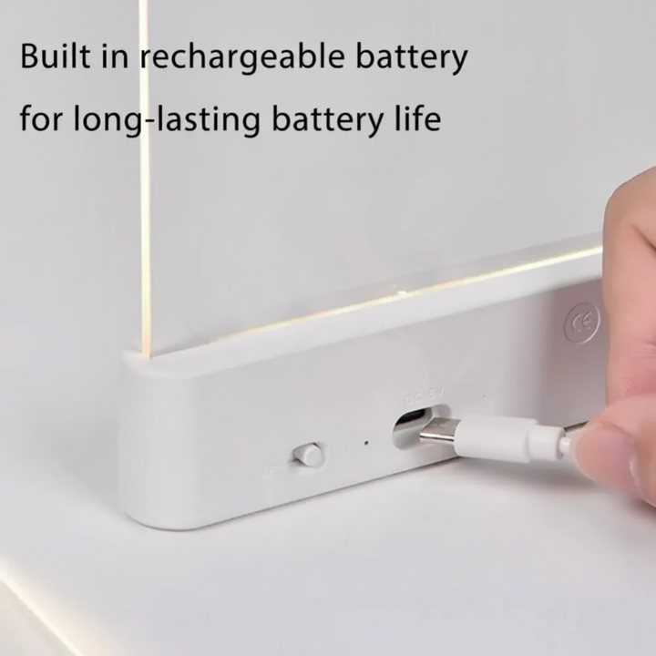 USB charging cable being connected to the back of a white LED book light