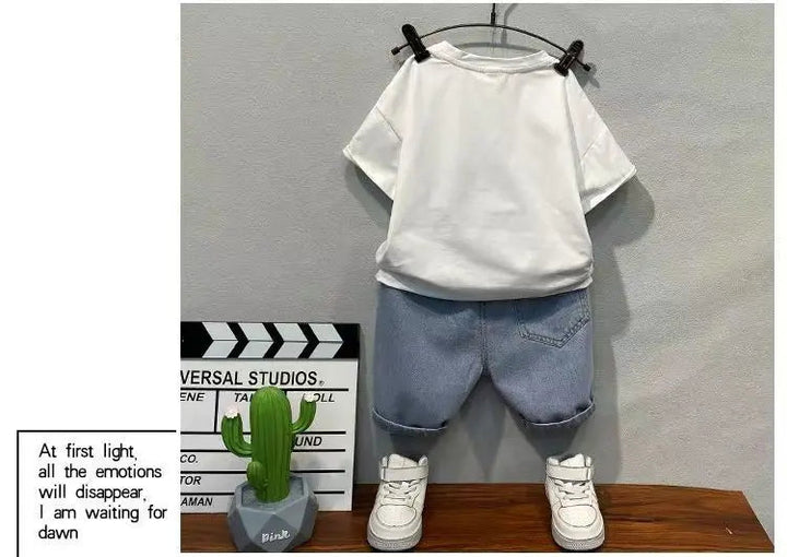 Back view of the white T-shirt and blue denim shorts with rear pockets