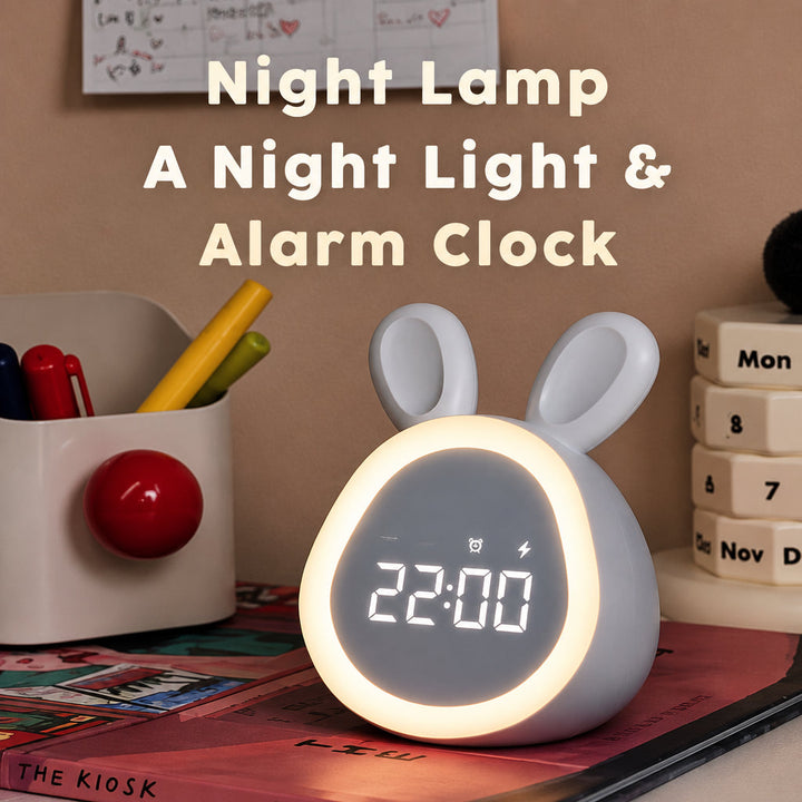 White bunny alarm clock with its light ring glowing on a desk