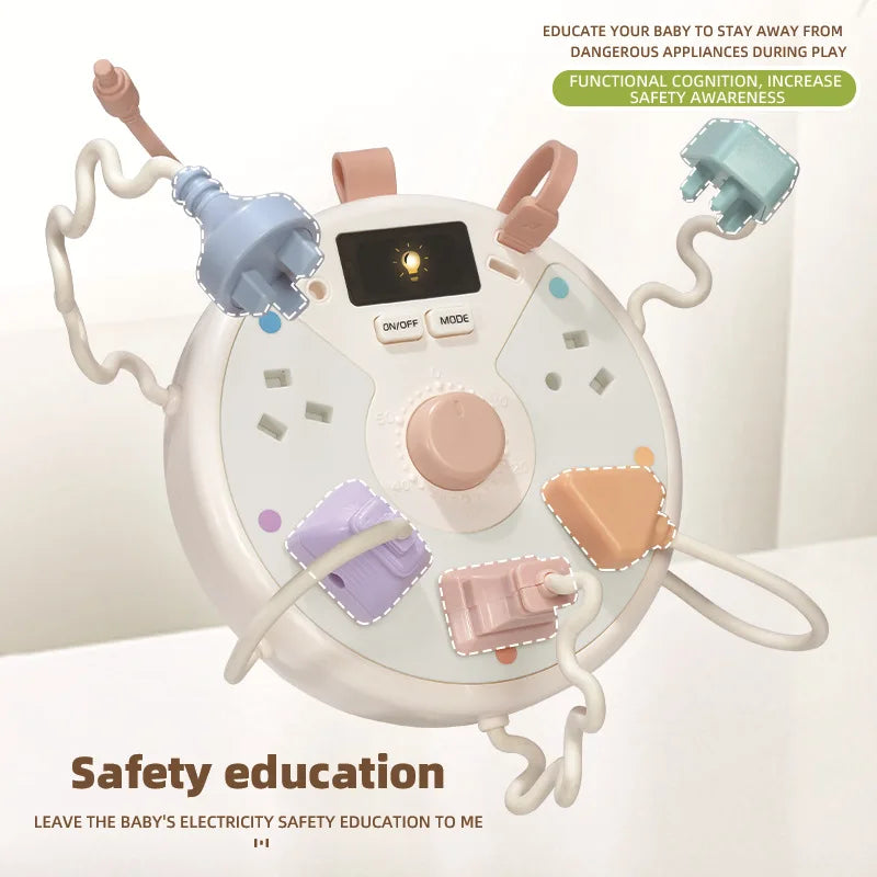 White busy board with pastel toy plugs, a peach center dial and coiled cords
