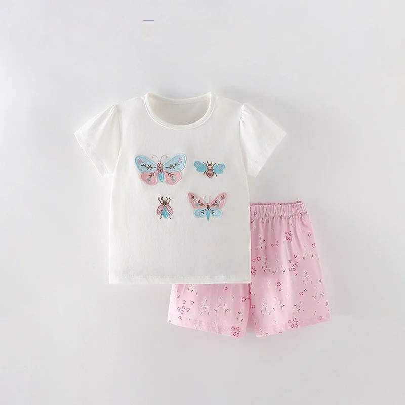 White butterfly-print T-shirt with pink patterned shorts