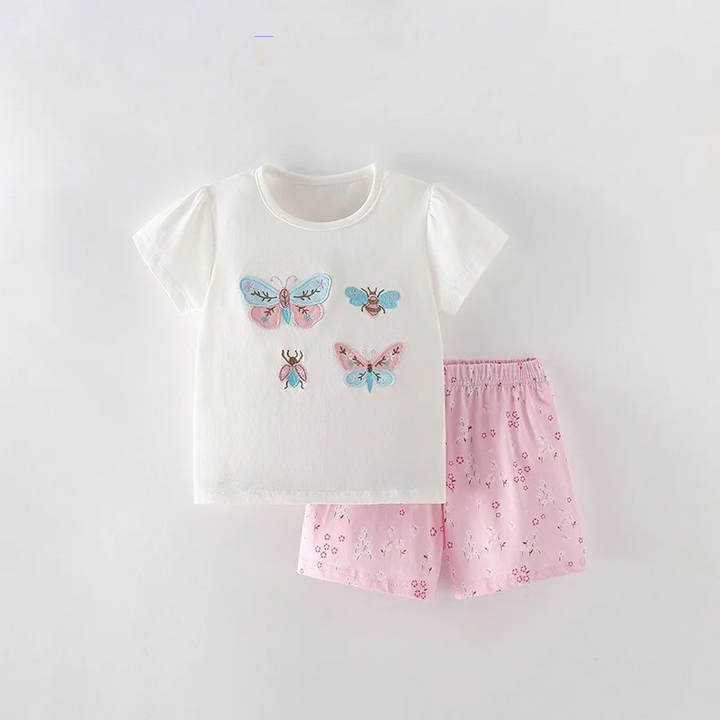 White butterfly-print T-shirt with pink patterned shorts