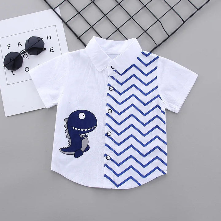 White collared button-front shirt with a dinosaur graphic and blue zigzag panel