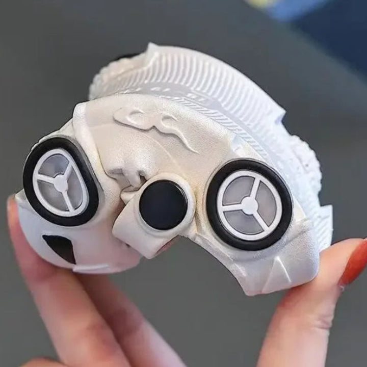 A white car slipper bent by hand to show its flexible sole.