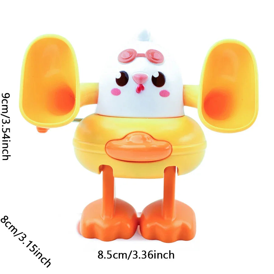 White chick toy with yellow wings, labeled 9 cm high, 8.5 cm wide, and 8 cm deep