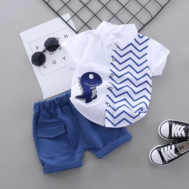 White dinosaur shirt paired with blue cuffed shorts