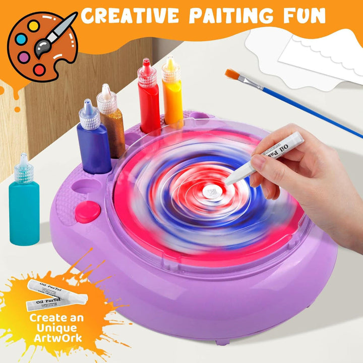 Hand using a white crayon on a spinning painted artboard in the purple machine