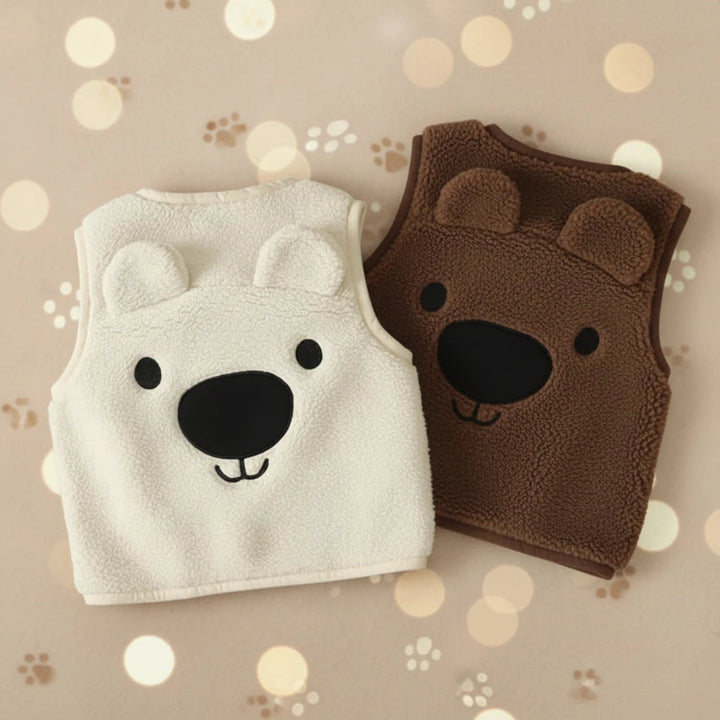 White and dark brown fleece vests with large bear faces and raised ears on the backs.
